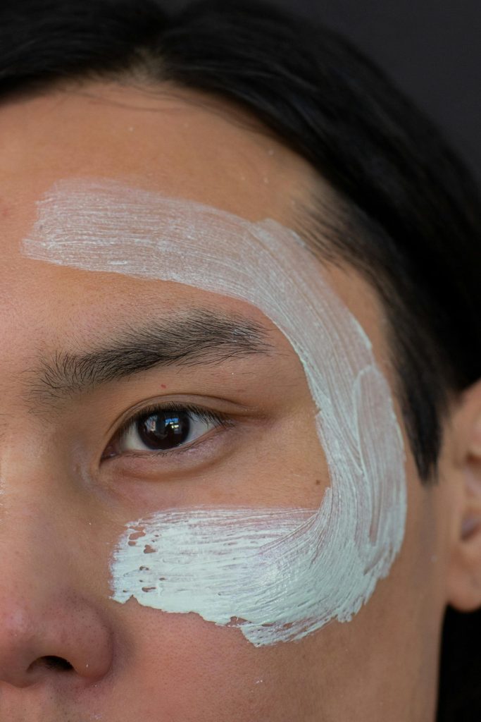 Image of man with face cream on his face.
